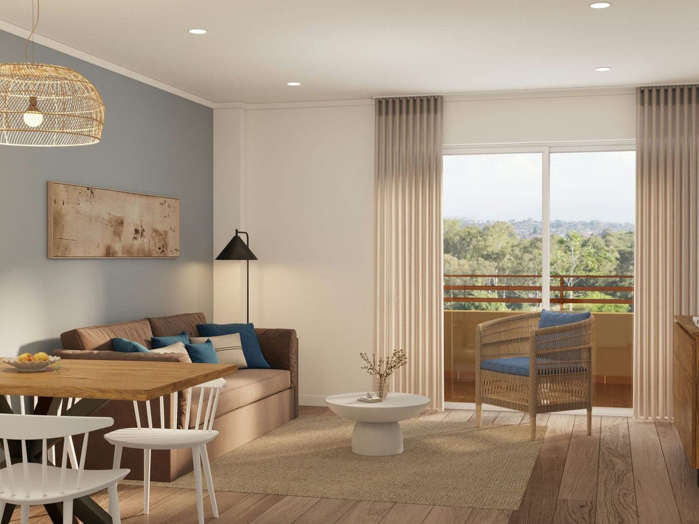 Salón de un apartamento de un dormitorio con sofá, mesa de comedor y puertas correderas a un balcón con vistas a la vegetación