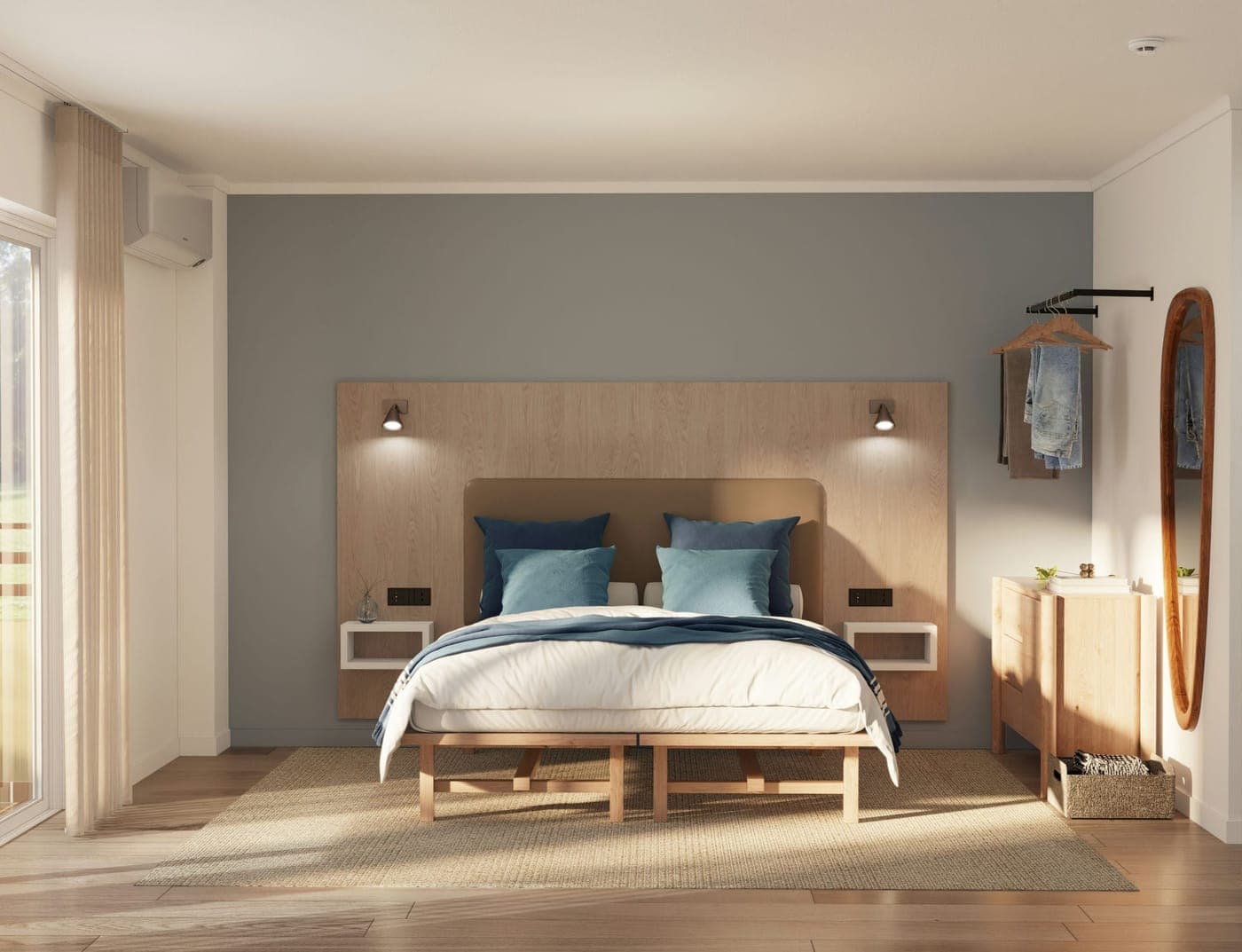 Dormitorio de un estudio con cama doble, cabecero de madera y cojines azules
